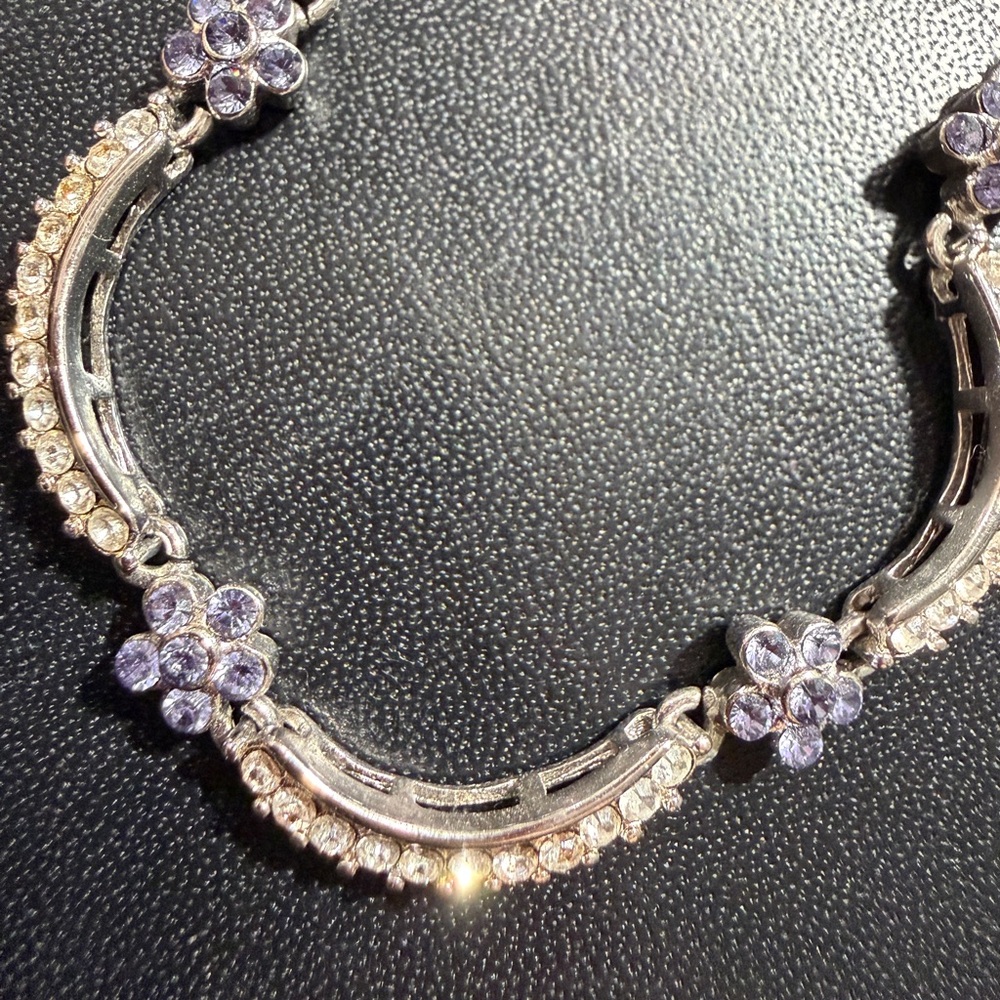 Bracelet silver w/ CZ (diamond like) with blue small flowers.